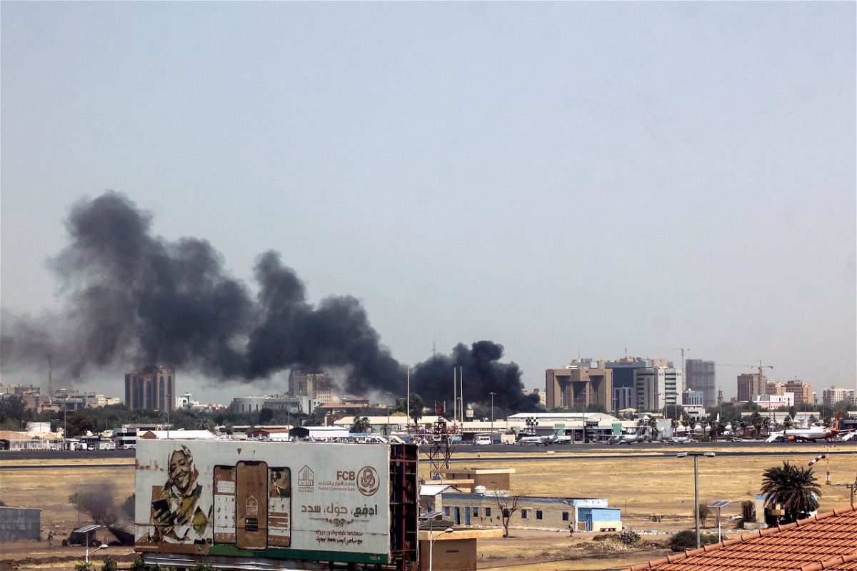 <i>AFP/Getty Images</i><br/>Heavy smoke bellows above buildings in the vicinity of the Khartoum's airport on April 15