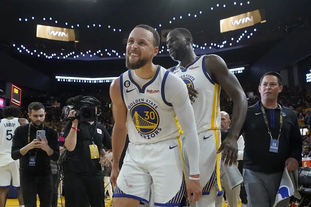 Golden State Warriors guard Stephen Curry (30) celebrates with forward Draymond Green after the Warriors defeated the Sacramento Kings in Game 4 in the first round of the NBA basketball playoffs in San Francisco, Sunday, April 23, 2023. 