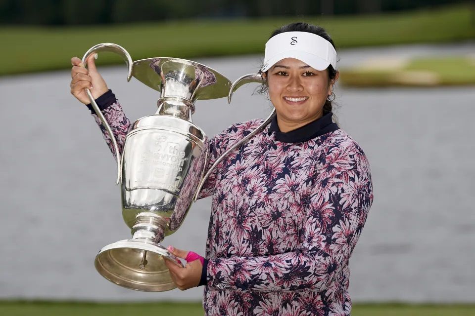 Lilia Vu holds the trophy after her playoff win against Angel Yin in the Chevron Championship women's golf tournament at The Club at Carlton Woods on Sunday, April 23, 2023, in The Woodlands, Texas.