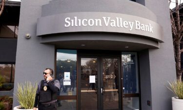 A security guard stands outside of the entrance of the Silicon Valley Bank headquarters in Santa Clara