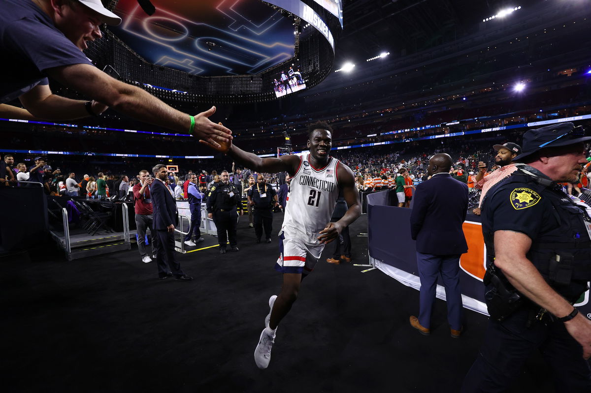 <i>Jamie Schwaberow/NCAA Photos/Getty Images</i><br/>Adama Sanogo #21 of the Connecticut Huskies celebrates after defeating the Miami Hurricanes during the NCAA Men's Basketball Tournament Final Four semifinal game Saturday at NRG Stadium in Houston