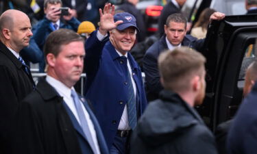 President Joe Biden waves to members of the public who have gathered for his arrival on April 12