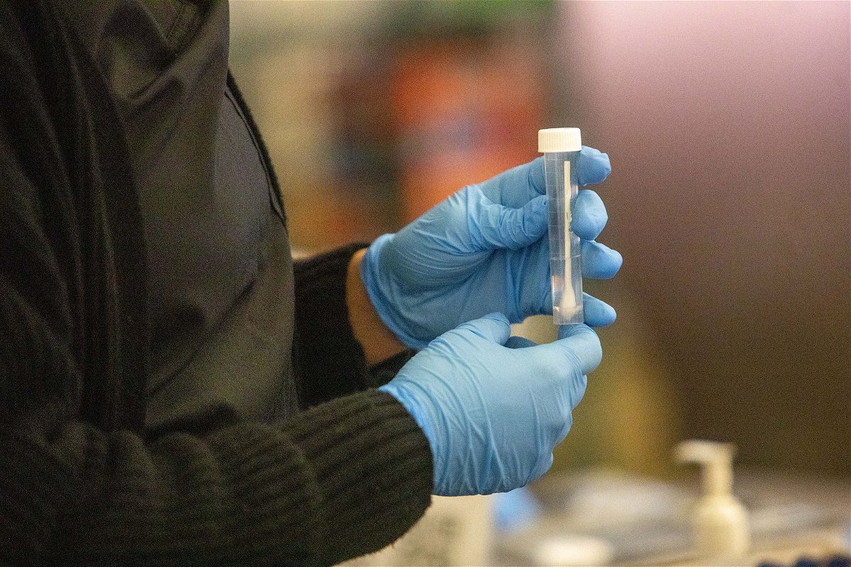 <i>Jill Connelly/Bloomberg/Getty Images</i><br/>A test swab at a CDC Covid-19 variant testing site inside Tom Bradley International Terminal at Los Angeles International Airport (LAX) is pictured here on January 9.