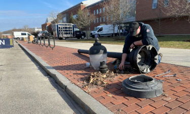 A street light is repaired at UConn after fans spilled onto campus to celebrate.