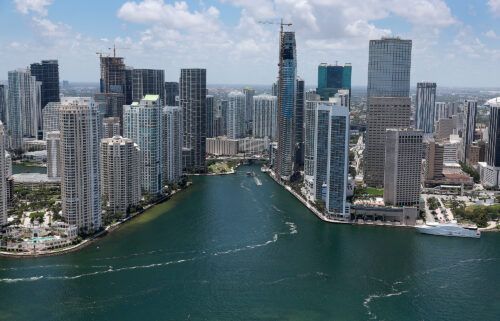 An aerial view of the City of Miami skyline is seen next to the waters of Biscayne Bay on July 21