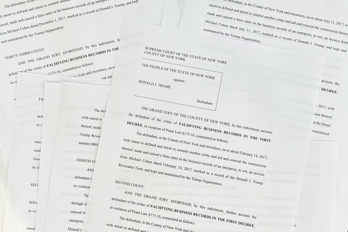 <i>Rebecca Wright/CNN</i><br/>This photo taken on April 4 shows a copy of the unsealed indictment for former President Donald Trump.