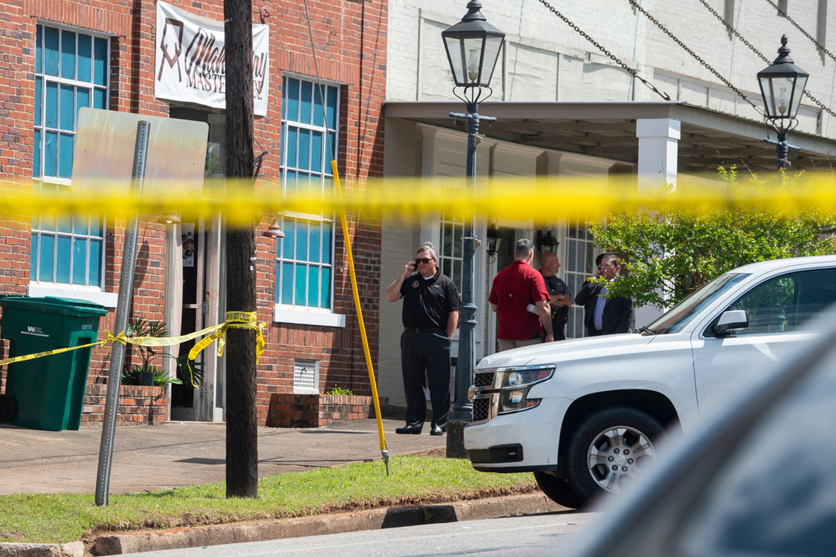 Law enforcement continues to investigate a mass shooting at Mahogany Masterpiece dance studio in Dadeville , Ala., on Sunday, April 16, 2023. (Jake Crandall/The Montgomery Advertiser via AP)