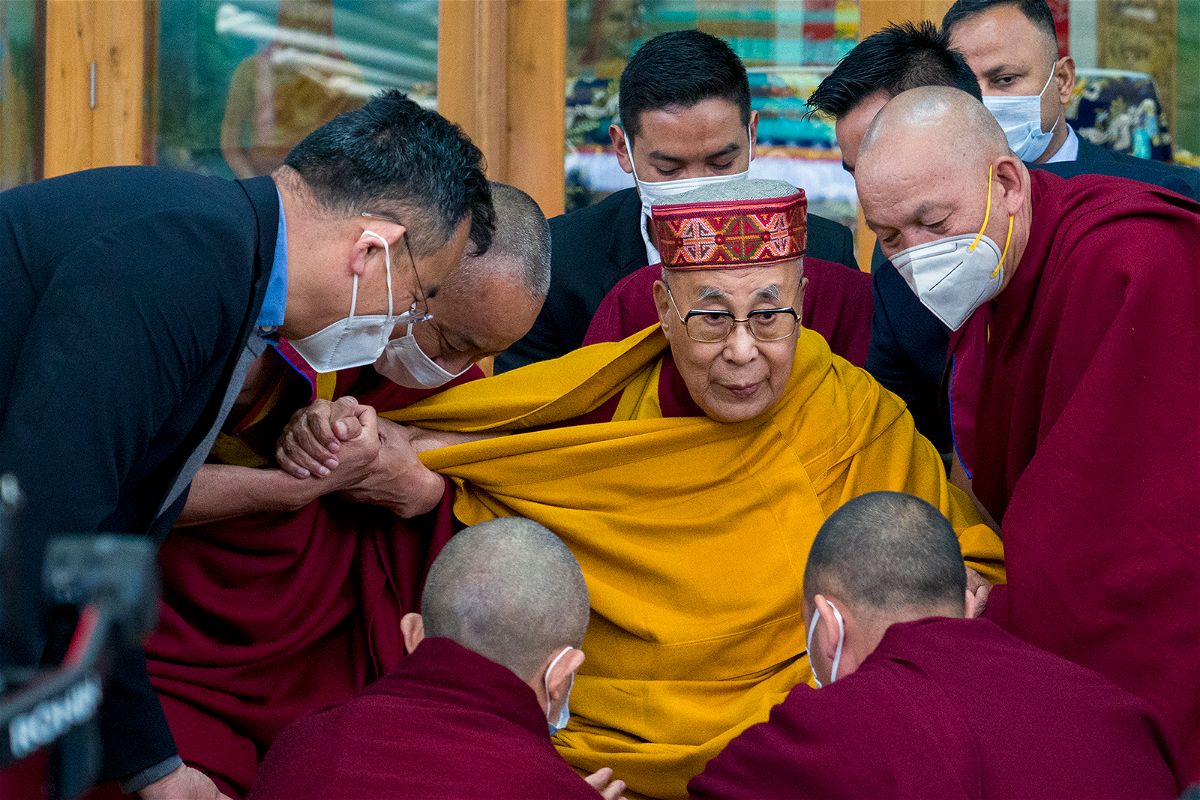 <i>Ashwini Bhatia/AP</i><br/>Tibetan spiritual leader the Dalai Lama is helped by attending monks after he addressed a group of students at the Tsuglakhang temple in Dharamshala