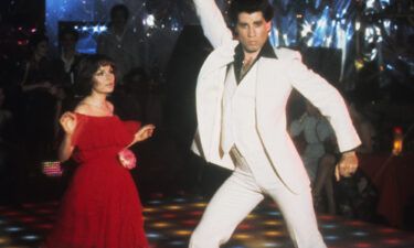 Travolta wore the white suit in the film's famous dance competition scene.