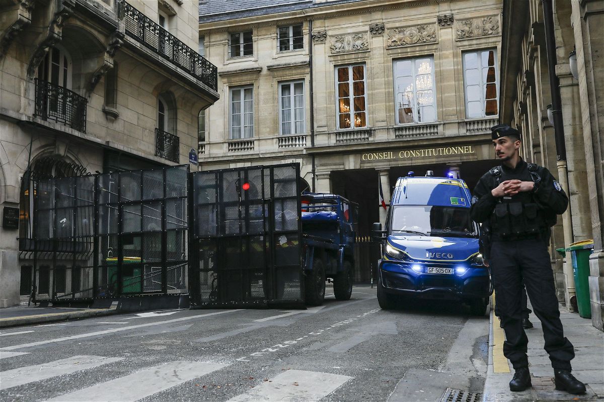 <i>Ian Langsdon/AFP/Getty Images</i><br/>Heightened security is in place in the French capital Paris as the country braces for a crucial ruling on the constitutionality of divisive changes to France's pension system. A French gendarme stands guard in Paris on April 14.