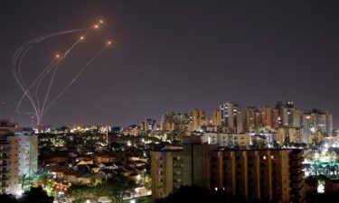 Streaks of light are seen as Israel's Iron Dome anti-missile system intercept rockets launched from the Gaza Strip