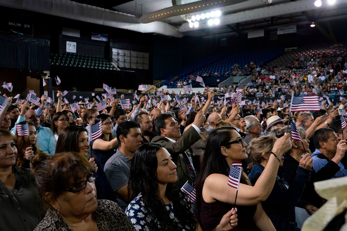 Immigrants being sworn in as United States Citizens take their oaths during the Naturalization Ceremony at El Paso County Coliseum, in El Paso, Texas on April 18, 2019. - About 740 immigrants from countries all over the world were sworn in as United States Citizens. (Photo by Paul Ratje / AFP) (Photo credit should read PAUL RATJE/AFP via Getty Images)