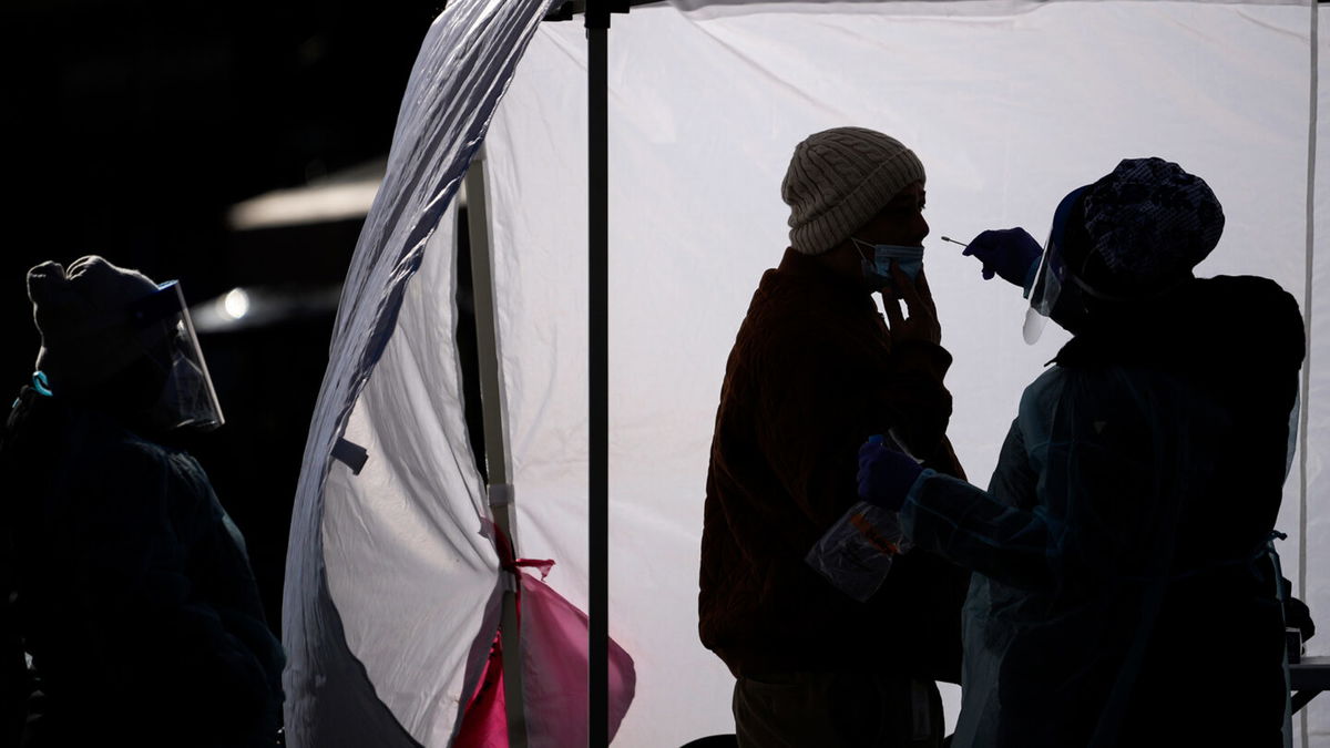 <i>Drew Angerer/Getty Images</i><br/>A man is tested for Covid-19 at a free testing site in downtown Washington