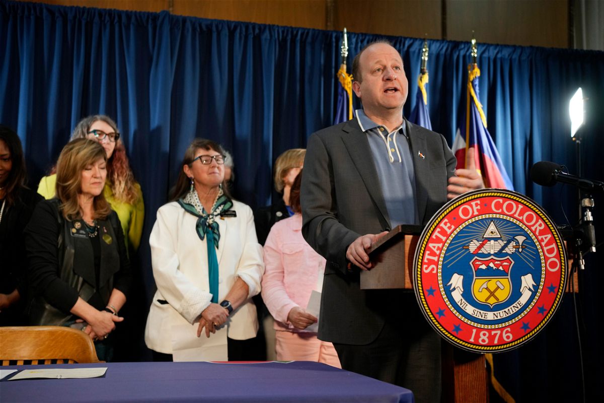 <i>David Zalubowski/AP</i><br/>Colorado Gov. Jared Polis speaks at the State Capitol in Denver on April 14. Polis signed a trio of bills Friday that further protect the rights to abortion and gender-affirming services in the state.
