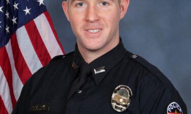 Officer Cory "CJ" Galloway shot and killed the gunman from the steps in front of the bank