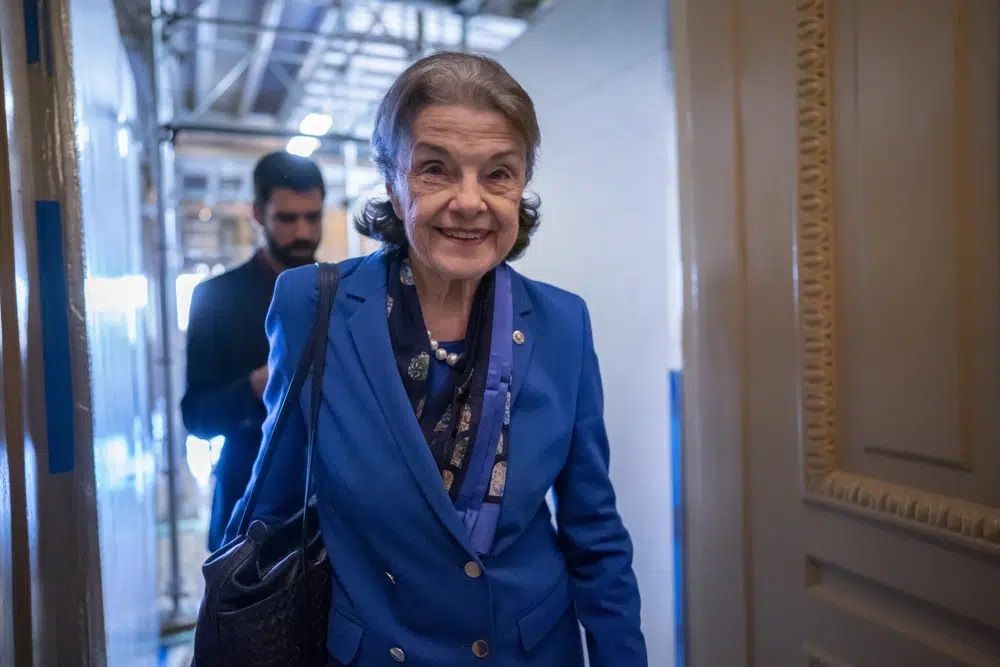 Sen. Dianne Feinstein, D-Calif., walks through a Senate corridor at the Capitol in Washington, Feb. 14, 2023. Feinstein is returning to Washington after a more than two month absence led to calls from within her own party for the oldest member of Congress to resign. The California Democrat announced in early March that she had been hospitalized in San Francisco and was being treated for a case of shingles. The 89-year-old senator planned to be back in Washington in March but never appeared as her recovery took longer than expected.