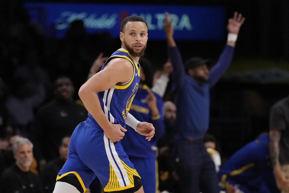 Golden State Warriors guard Stephen Curry runs back after scoring during the first half in Game 6 of an NBA basketball Western Conference semifinal series against the Los Angeles Lakers Friday, May 12, 2023, in Los Angeles