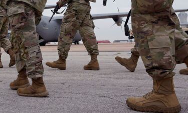 This file photo shows members of the Texas National Guard prepare to deploy to the Texas-Mexico border in Austin