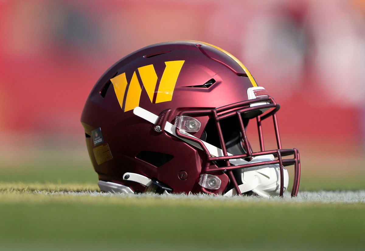 SANTA CLARA, CALIFORNIA - DECEMBER 24: A detailed view of a helmet belonging to a Washington Commander player is seen on the field during pregame warm ups prior to the game against the San Francisco 49ers at Levi's Stadium on December 24, 2022 in Santa Clara, California. (Photo by Thearon W. Henderson/Getty Images)