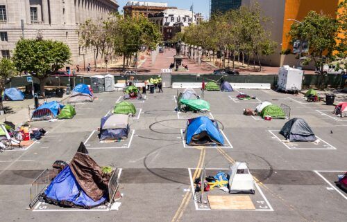 Rectangles are painted on the ground to encourage homeless people to keep social distancing at a city-sanctioned homeless encampment across from City Hall in San Francisco in May 2020.