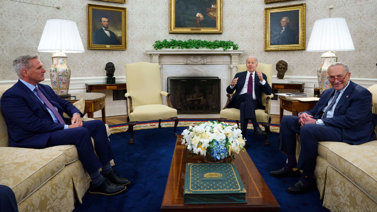 Speaker of the House Kevin McCarthy of Calif., left, and Senate Majority Leader Sen. Chuck Schumer of N.Y., right, listen as President Joe Biden before a meeting on the debt limit in the Oval Office of the White House, Tuesday, May 9, 2023, in Washington. (AP Photo/Evan Vucci)