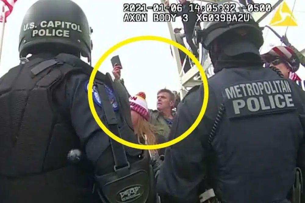 This image from Washington Metropolitan Police Department body-worn video, released and annotated by the Justice Department in the statement of facts supporting an arrest warrant for Jay James Johnston, shows Johnston, circled in yellow, at the U.S. Capitol on Jan. 6, 2021, in Washington. Johnston, the actor known for his roles on the comedy television shows 