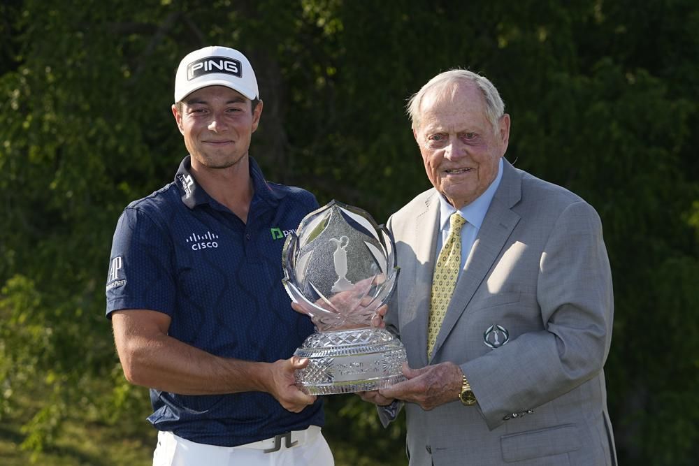 Viktor Hovland, left, of Norway, and Jack Nicklaus hold the trophy after Hovland won the Memorial golf tournament, Sunday, June 4, 2023, in Dublin, Ohio