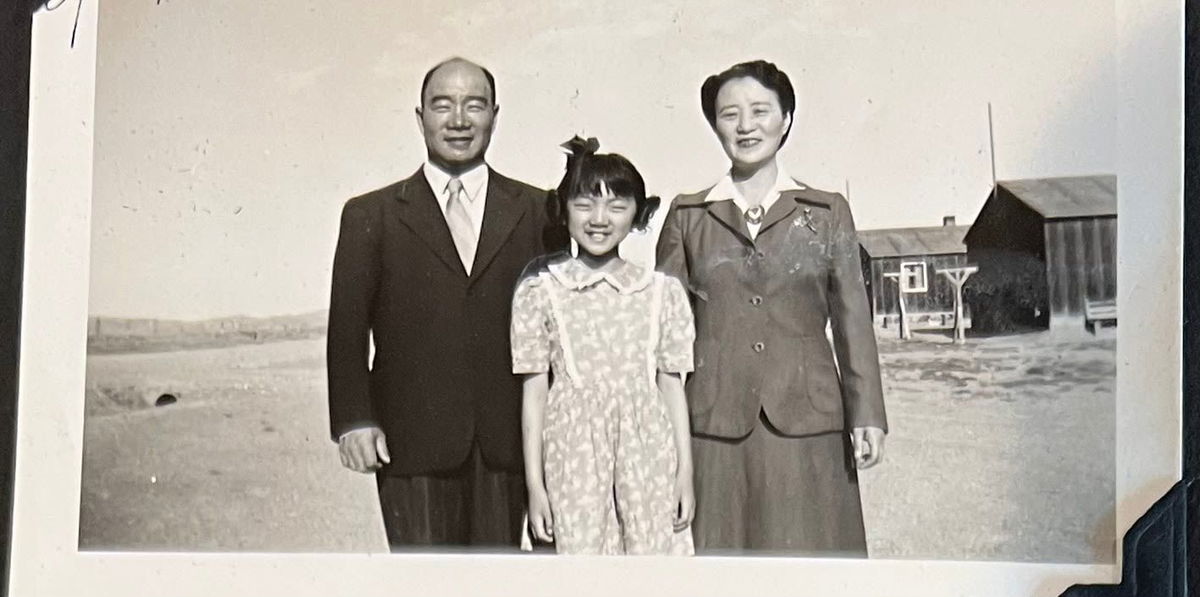 <i>Courtesy Amy Iwasaki Mass</i><br/>Amy Iwasaki Mass was a first grader when her family was forced to live in an internment camp in Wyoming. Here she poses with her parents while incarcerated.