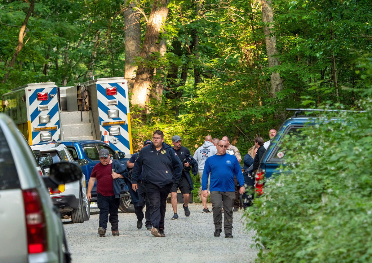 <i>Randall K. Wolf via AP</i><br/>Search and rescue teams assemble before going to the site of Sunday's plane crash near Montebello