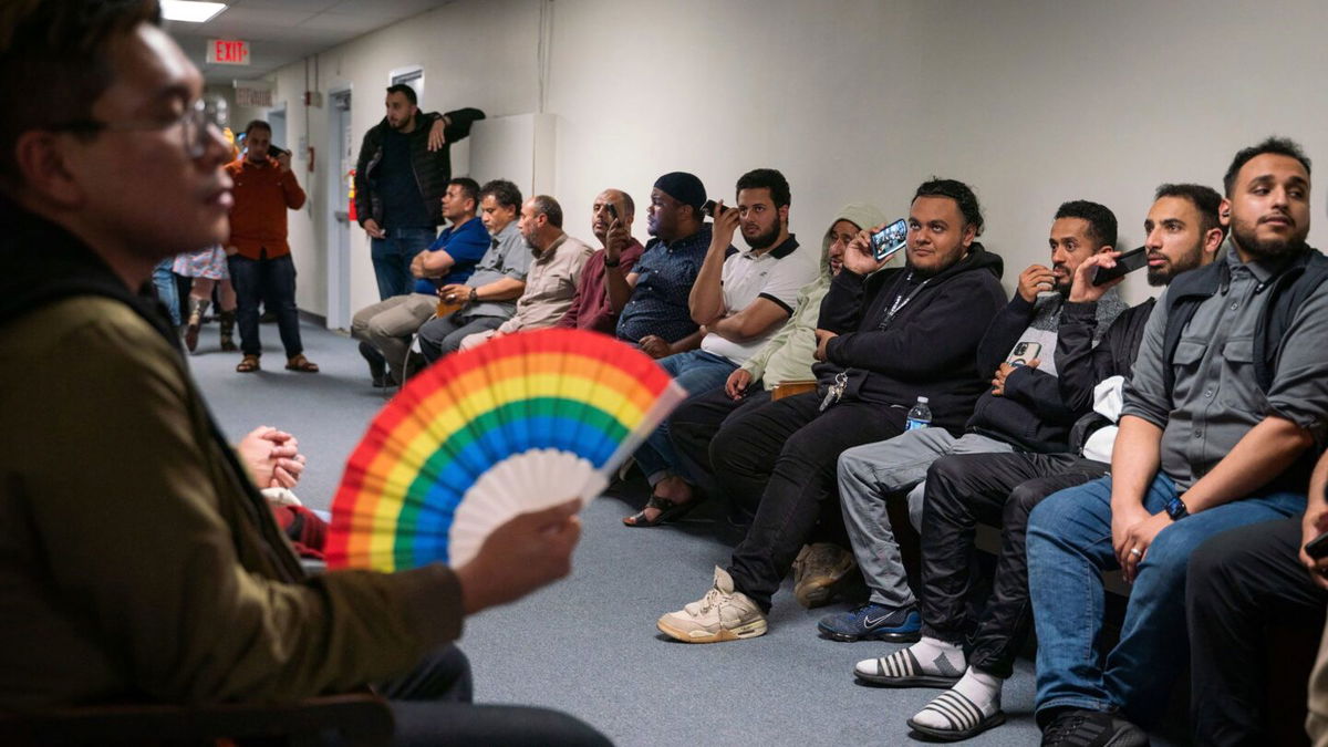 <i>Sarahbeth Maney/Detroit Free Press/USA Today Network</i><br/>People overflow into a hallway to listen to public comment before the vote about banning the LGBTQ Pride flag on government buildings and city property