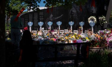 People come to mourn at a memorial site after the 4th of July parade shooting in Highland Park