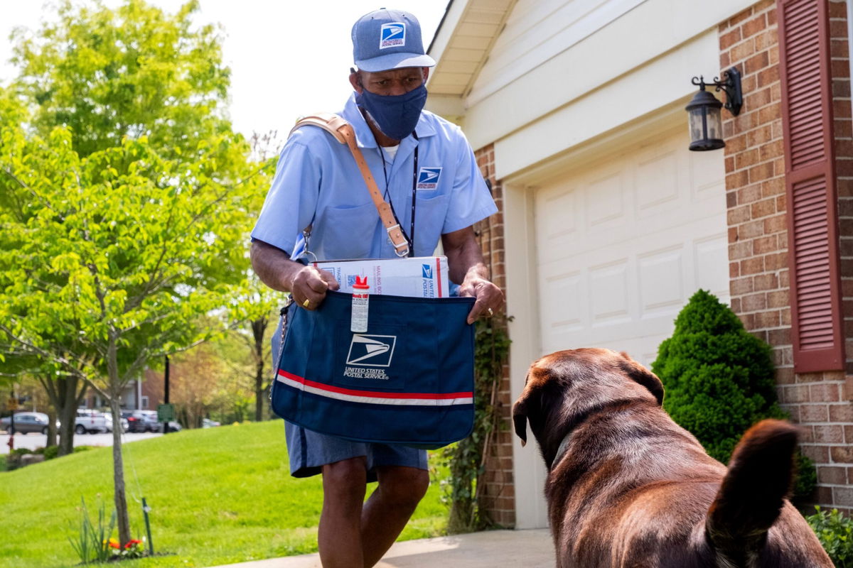 <i>Daniel Afzal/USPS</i><br/>The US Postal Service's dog bite awareness campaign draws attention to a nationwide problem and asks dog owners to help assure the safety of letter carriers.