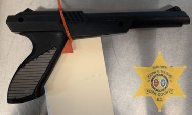 A spray-painted Nintendo "Duck Hunt" game pistol.