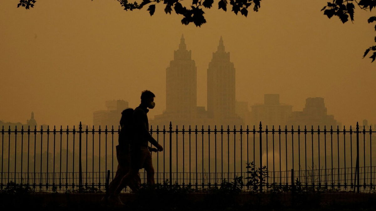 <i>Timothy A. Clary/AFP/Getty Images</i><br/>People walk in Central Park on June 7.