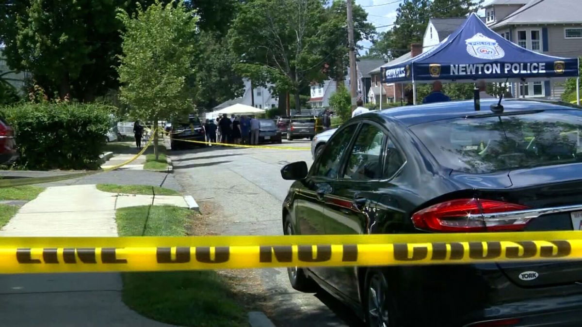 <i>WCVB</i><br/>Police are seen at the location of an apparent triple homicide in Newton