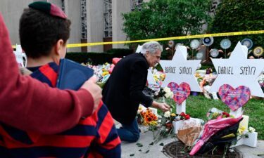 People pay their respects at a memorial outside the Tree of Life synagogue two days after the shooting.