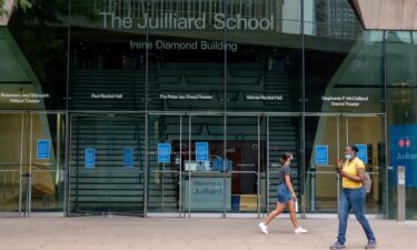 People walk past the Irene Diamond Building at The Juilliard School on August 3