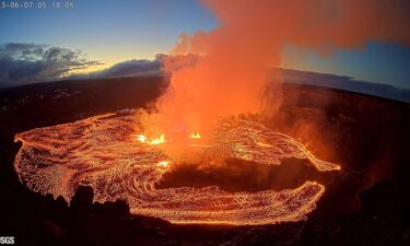 A lava lake forms at Halemaʻumaʻu as seen from the west rim of the Kilauea caldera during the volcano's eruption in Hawaii