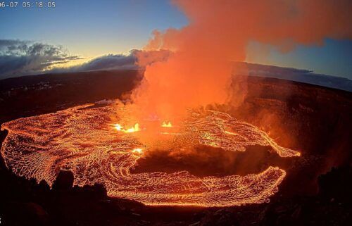 A lava lake forms at Halemaʻumaʻu as seen from the west rim of the Kilauea caldera during the volcano's eruption in Hawaii