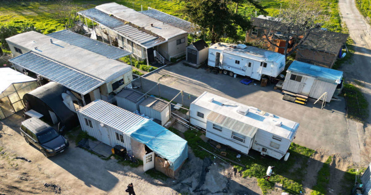 Some of the housing provided to the farmworkers and their families at the mushroom farm on Thursday, Jan. 26, 2023 in Half Moon Bay, Calif. The suspect is said to live with his wife in the upper left house with blue tarp.