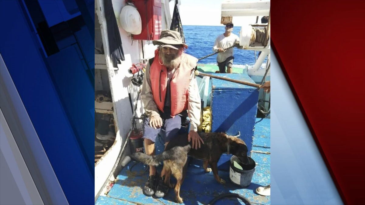 In this July 12, 2023 photo provided by Grupomar/Atun Tuny, Australian Tim Shaddock sits with his dog Bella after being rescued by a Mexican tuna boat in international waters, after being adrift with his dog for three months. haddock and his dog, Bella were aboard his incapacitated catamaran Aloha Toa some 1,200 miles from land when they were rescued