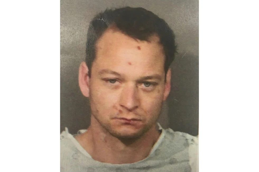 This undated photo released by the Placer County Sheriff’s Office shows fugitive Eric Abril, 35. Police are searching for Abril of California, who is accused of murder and has fled from a hospital in a Sacramento suburb early Sunday morning, July 9, 2023. In April, Abril was arrested for shooting a California Highway Patrol officer and two hostages, killing one, in a park in Roseville, a city about 16 miles (26 kilometers) northeast of Sacramento, according to police. 