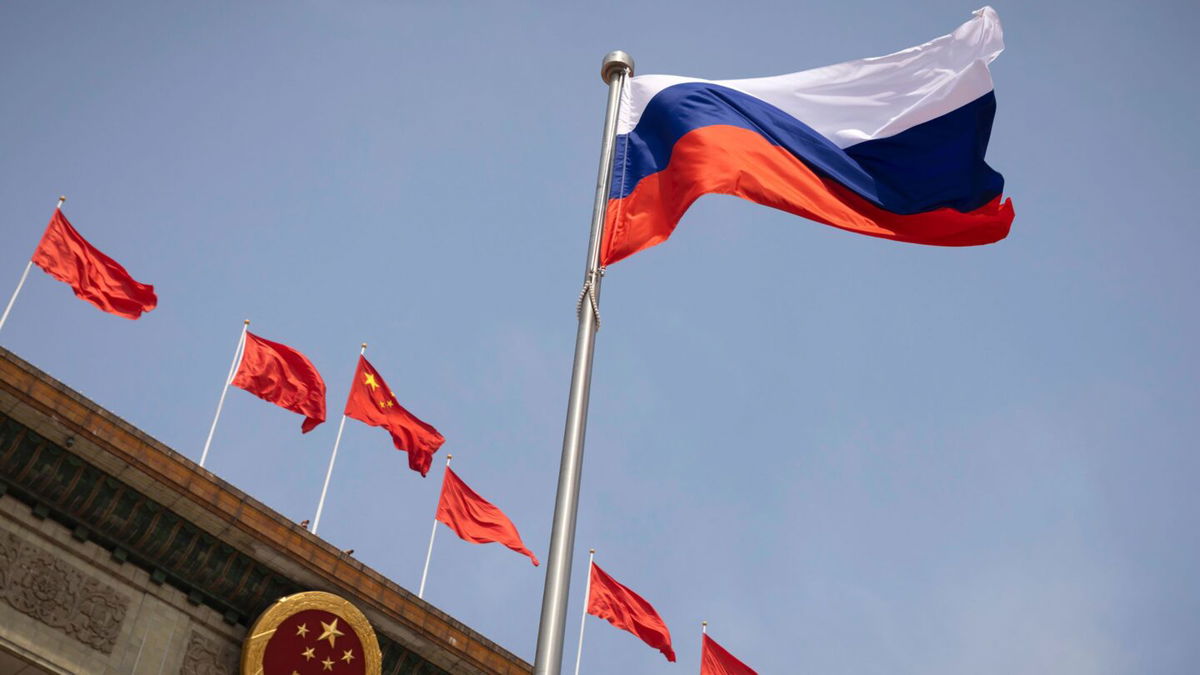 <i>Thomas Peter/Pool/AP</i><br/>The Russian national flag flies in front of the Great Hall of the People before a welcoming ceremony for Russian Prime Minister Mikhail Mishustin in Beijing