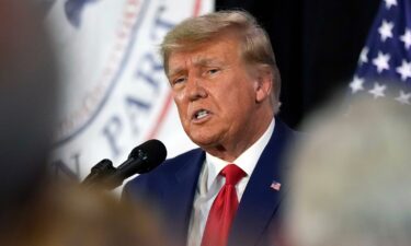 Former President Donald Trump visits with campaign volunteers at the Elks Lodge