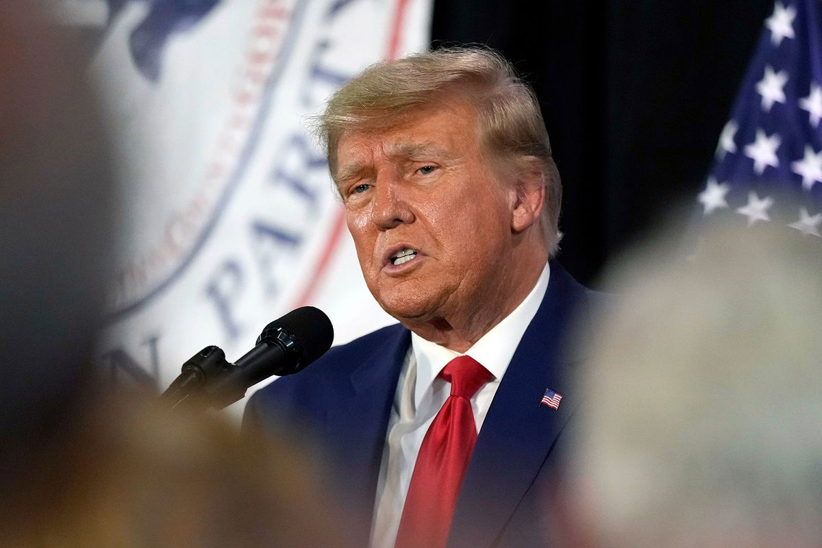 <i>Charlie Neibergall/AP</i><br/>Former President Donald Trump visits with campaign volunteers at the Elks Lodge