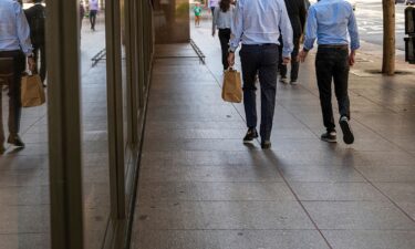 Pictured are pedestrians on California Street in the financial district of San Francisco