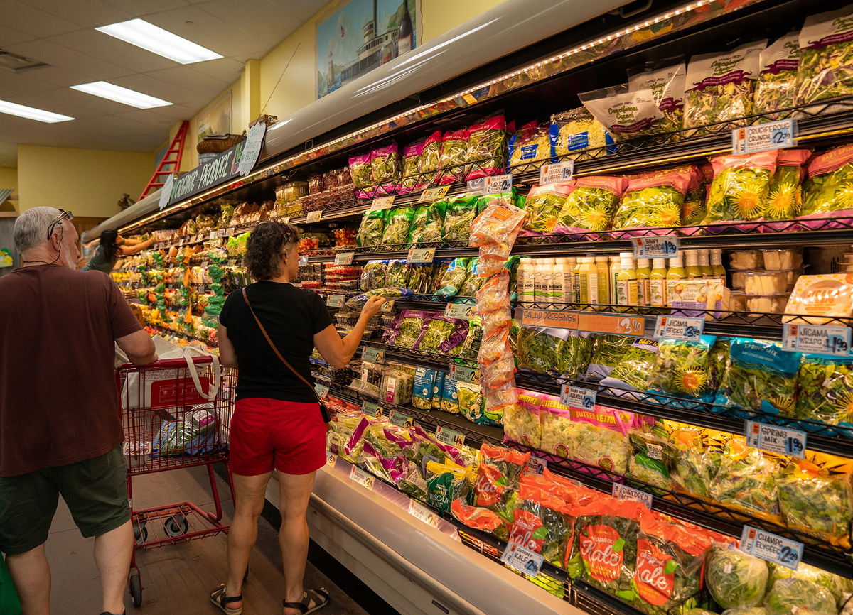 <i>Robert Nickelsberg/Getty Images</i><br/>People shop for fresh vegetables at a Trader Joe's supermarket in South Burlington