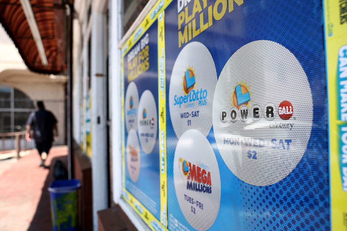 <i>Mario Tama/Getty Images</i><br/>A California Lottery poster advertises Powerball and other lotteries at a convenience store on July 18