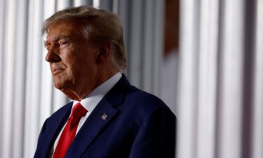 Former President Donald Trump prepares to speak at the Trump National Golf Club on June 13