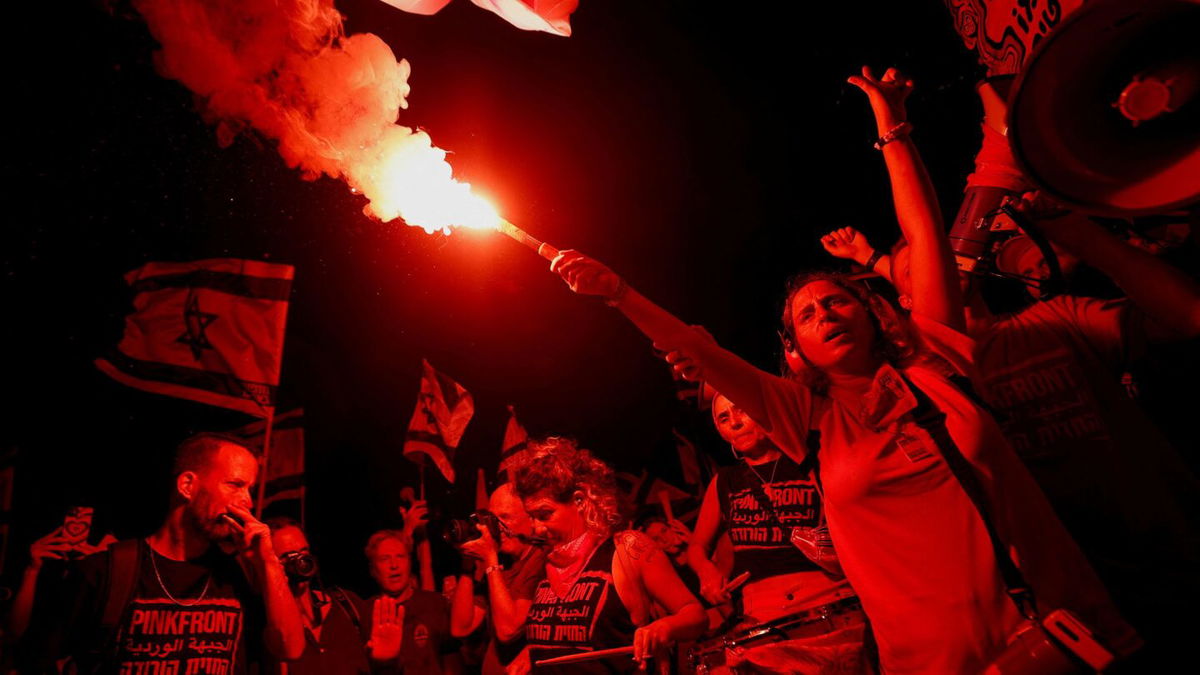 <i>Ariel Schalit/AP</i><br/>Israelis protest against plans to overhaul the judicial system in Tel Aviv